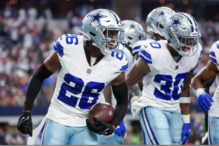 Oct 1, 2023; Arlington, Texas, USA; Dallas Cowboys cornerback DaRon Bland (26) celebrates with teammates after returning an interception for a touchdown during the first half against the New England Patriots at AT&T Stadium. Mandatory Credit: Kevin Jairaj-USA TODAY Sports